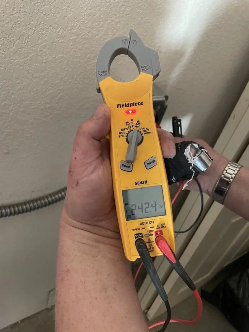 Voltage testing with clamp meter during Outlet Installation in Berkeley